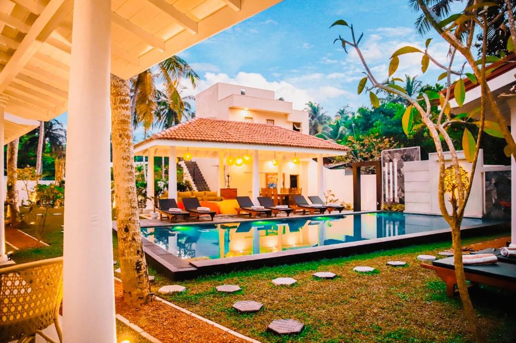 an image of a villa with a swimming pool at Tree of Life Resort in Bentota