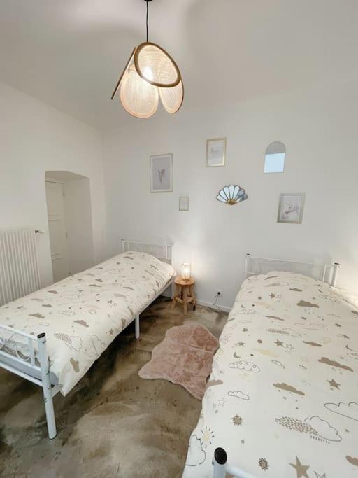 Posteľ alebo postele v izbe v ubytovaní Logis du Chandelier