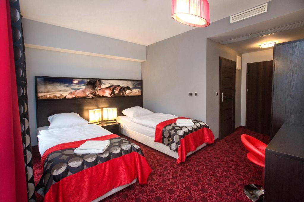 Postel nebo postele na pokoji v ubytování Hotel Zimowit