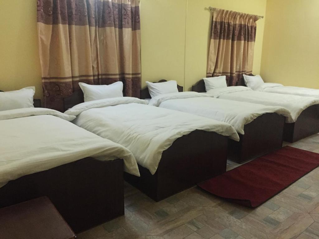 Letto o letti in una camera di Hello Inn Guest House & Apartment