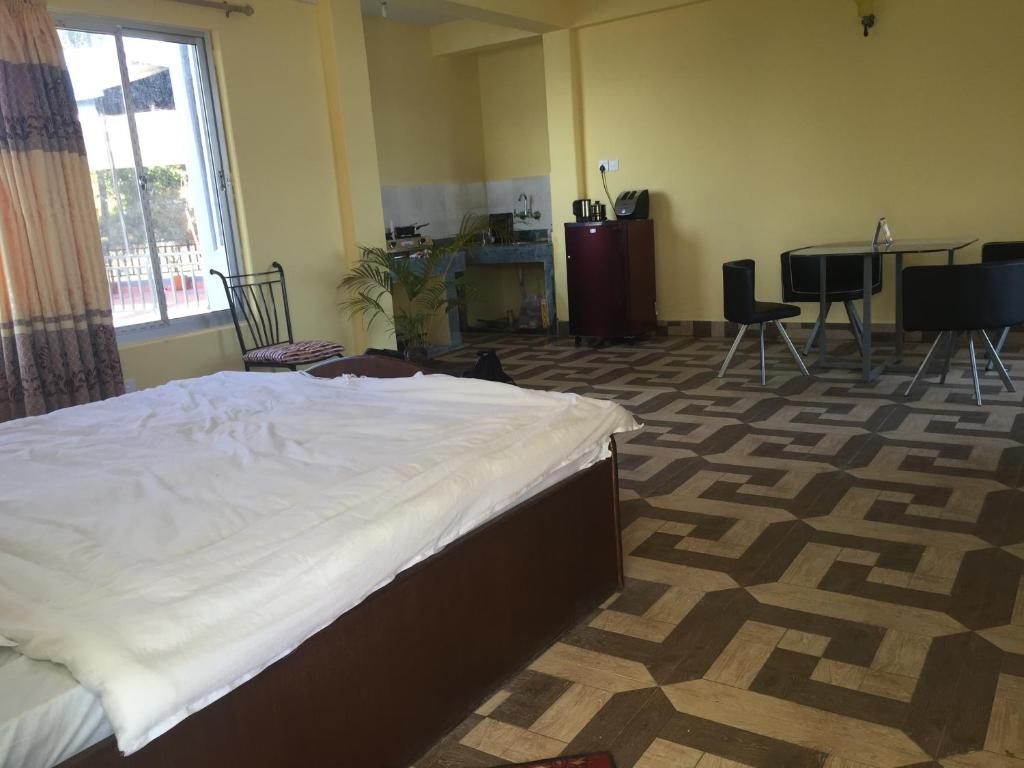Letto o letti in una camera di Hello Inn Guest House & Apartment