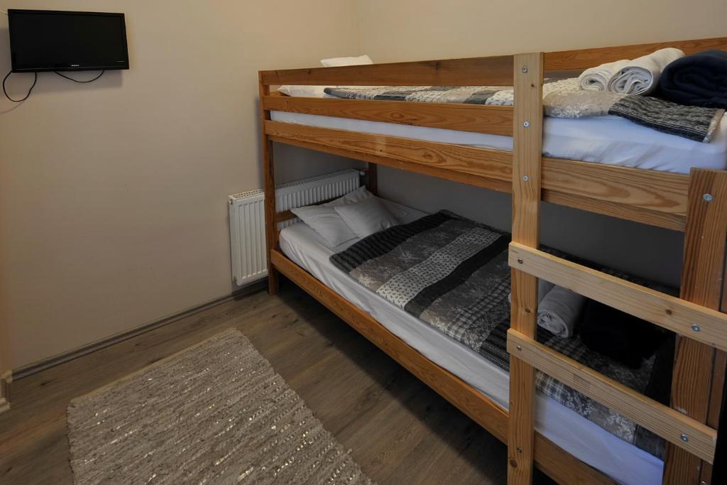 a couple of bunk beds in a room at Demetrovics Udvarház in Eger