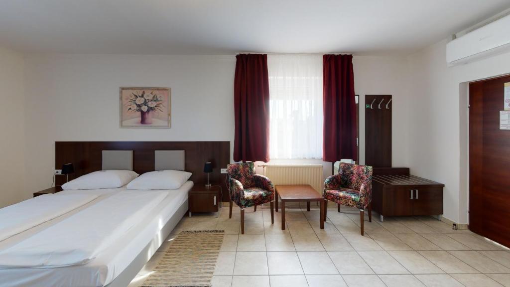 Postel nebo postele na pokoji v ubytování Hotel San Marco