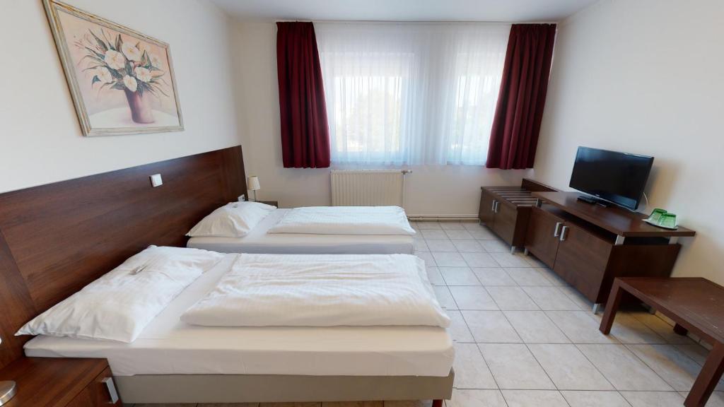 Postel nebo postele na pokoji v ubytování Hotel San Marco