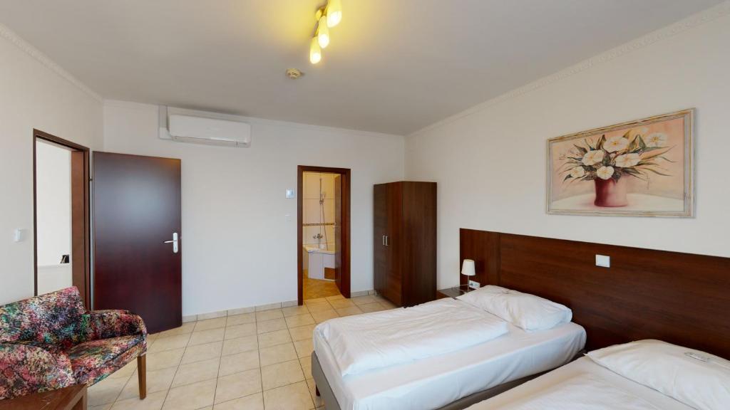 Postel nebo postele na pokoji v ubytování Hotel San Marco
