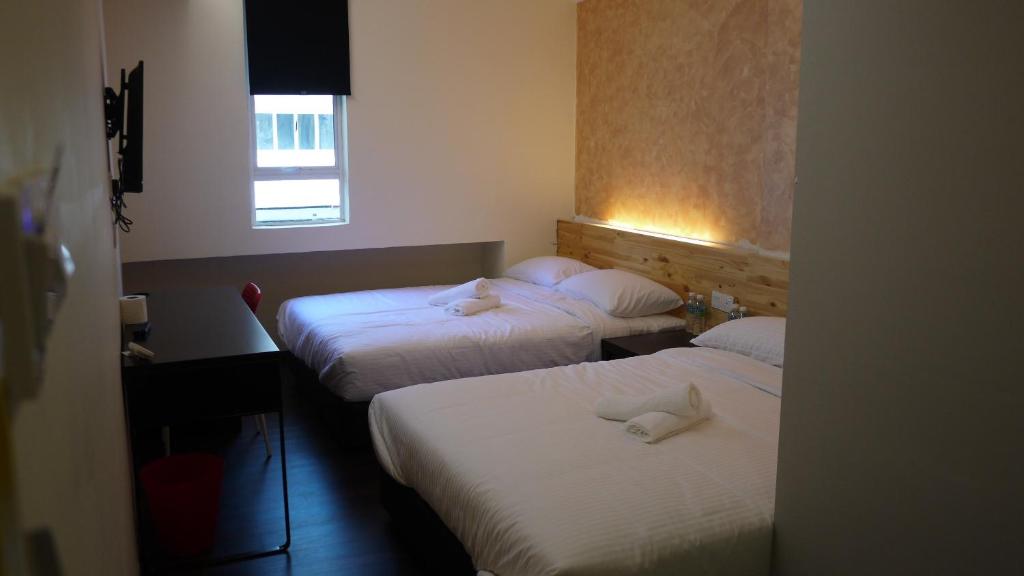 Postel nebo postele na pokoji v ubytování Dream Garden Hotel