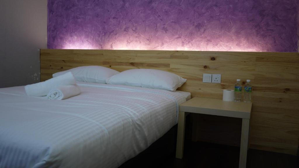 Postel nebo postele na pokoji v ubytování Dream Garden Hotel