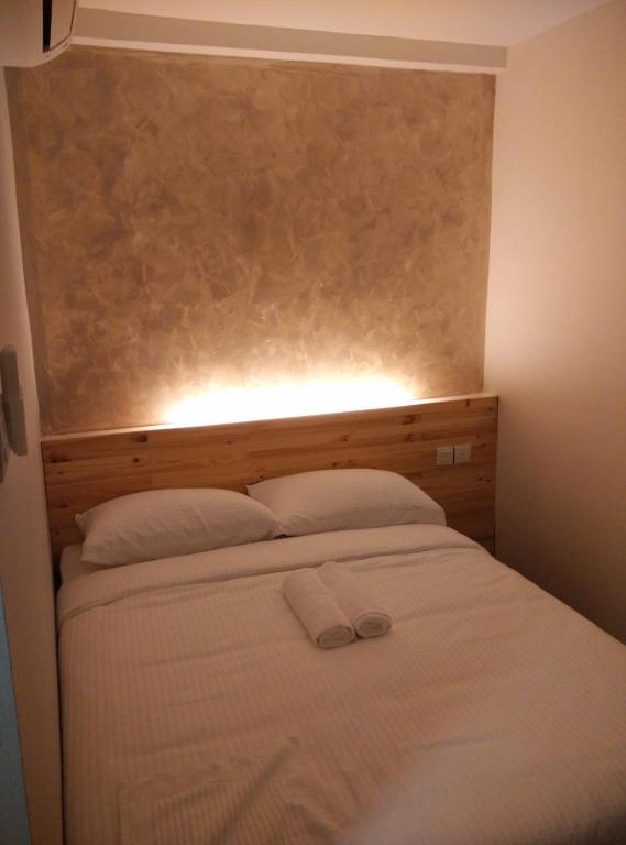 Postel nebo postele na pokoji v ubytování Dream Garden Hotel