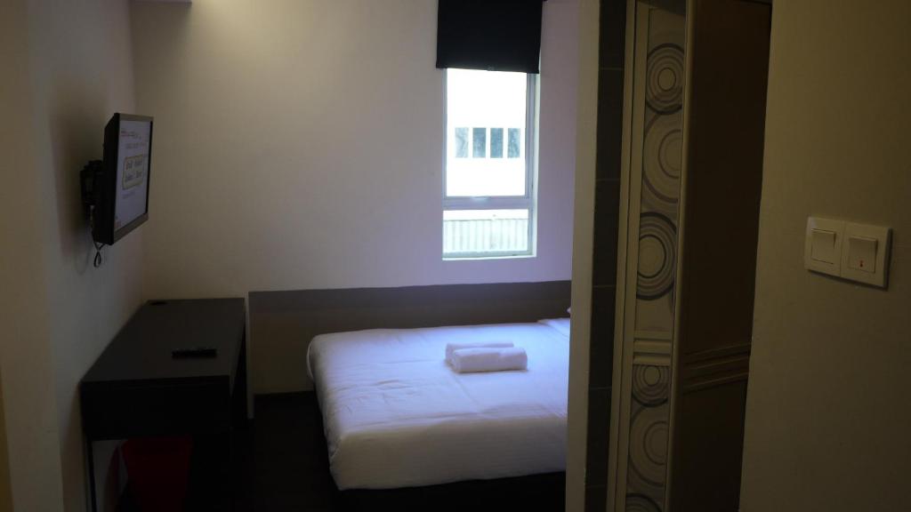 Postel nebo postele na pokoji v ubytování Dream Garden Hotel