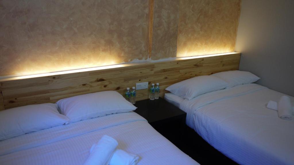 Postel nebo postele na pokoji v ubytování Dream Garden Hotel