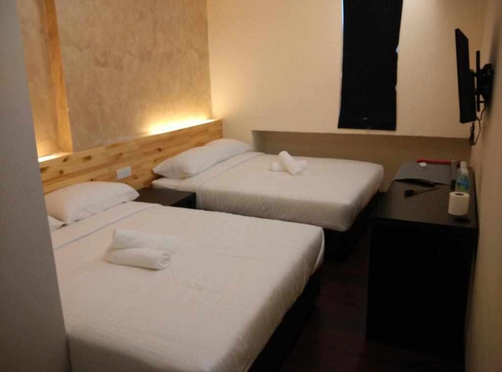 Postel nebo postele na pokoji v ubytování Dream Garden Hotel