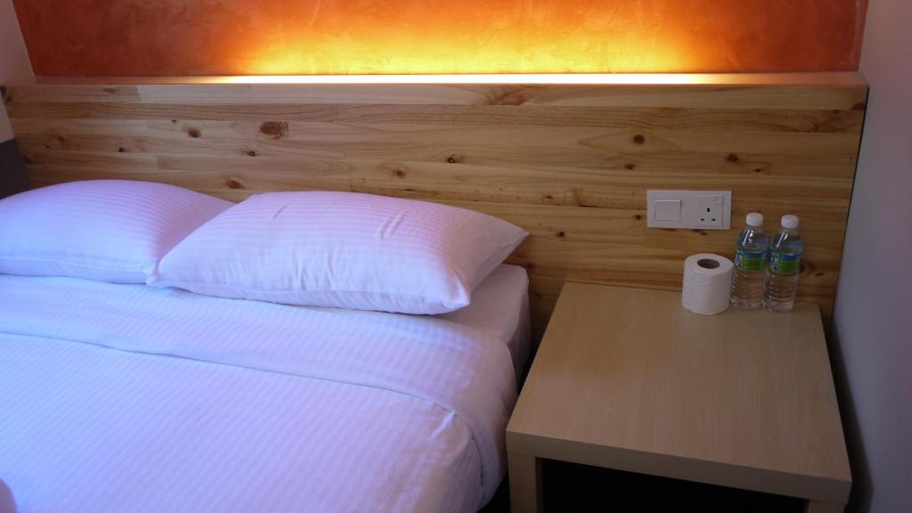 Postel nebo postele na pokoji v ubytování Dream Garden Hotel