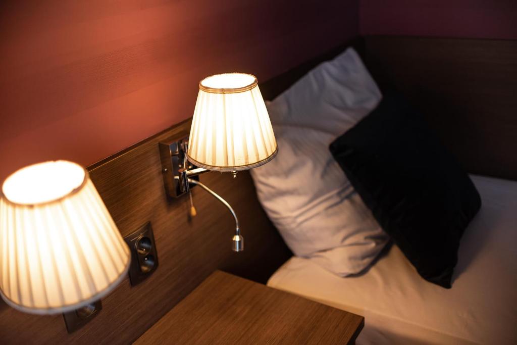 Postel nebo postele na pokoji v ubytování Hotel Podkowa