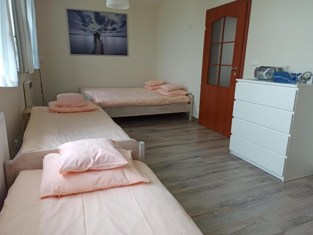 Posteľ alebo postele v izbe v ubytovaní Dom Gościnny Przy Jeziorze