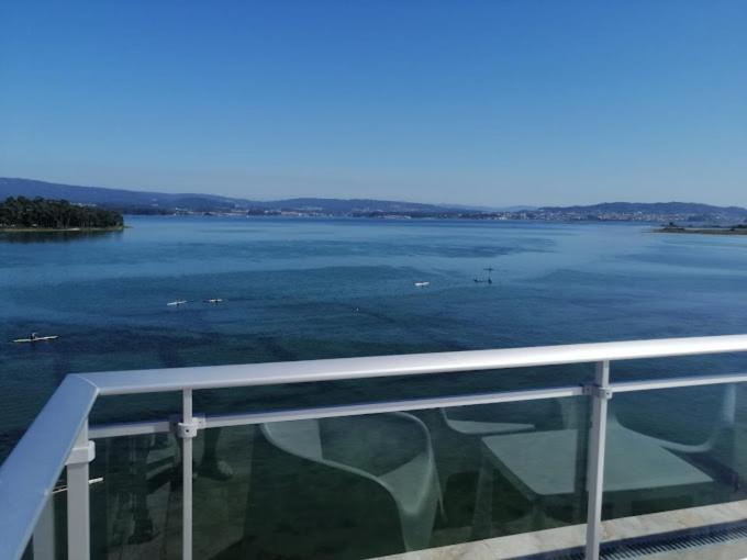 a view of a body of water from a balcony at Apartamentos O Grove Awa Bay in O Grove