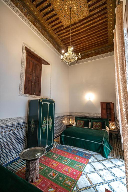Postel nebo postele na pokoji v ubytování Riad Arabella