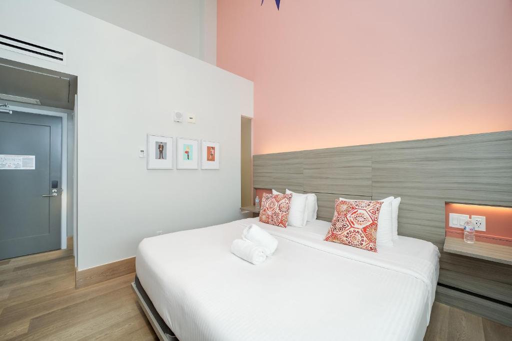 Postel nebo postele na pokoji v ubytování The Julia Hotel