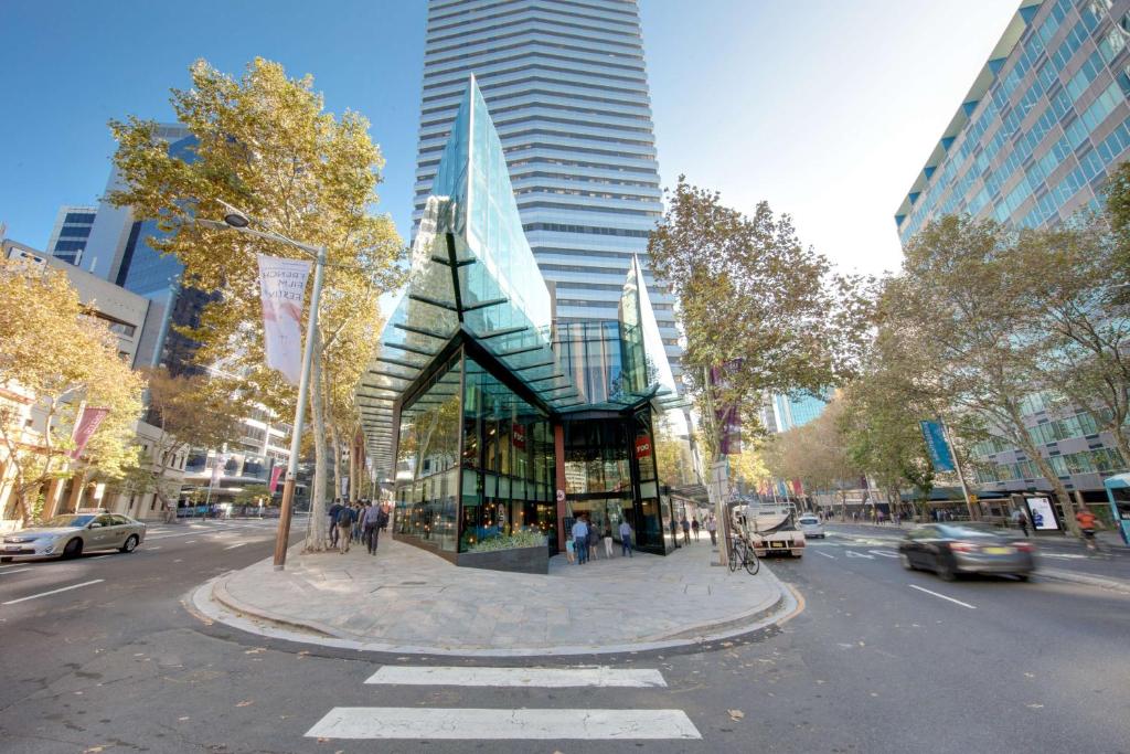 a building on a city street with a building at Vibe Hotel North Sydney in Sydney