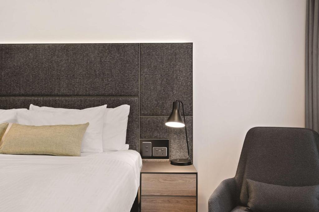 Postel nebo postele na pokoji v ubytování Vibe Hotel Melbourne