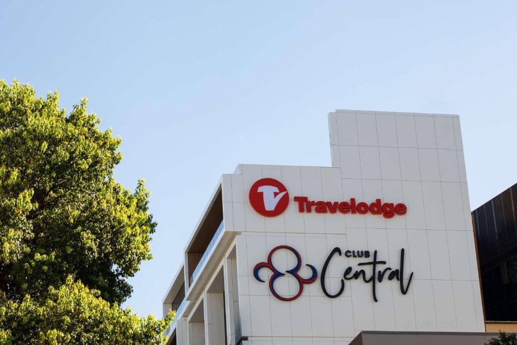 a sign for the tokyo olympics is shown on a building at Travelodge Hotel Hurstville Sydney in Sydney