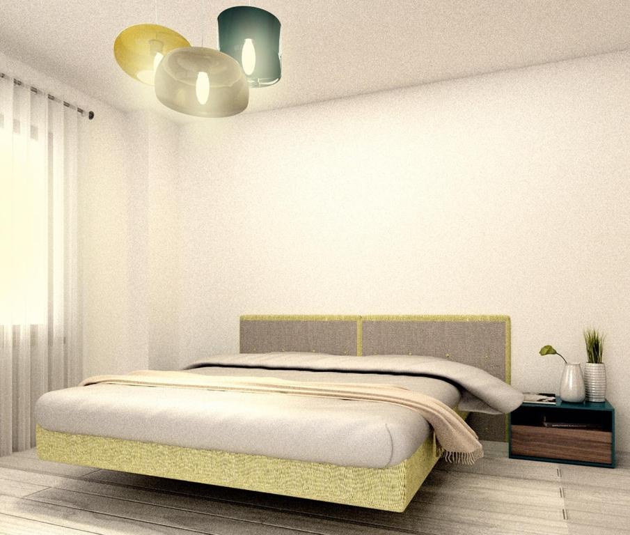 
Un pat sau paturi într-o cameră la Apartament Deluxe Solid Mamaia
