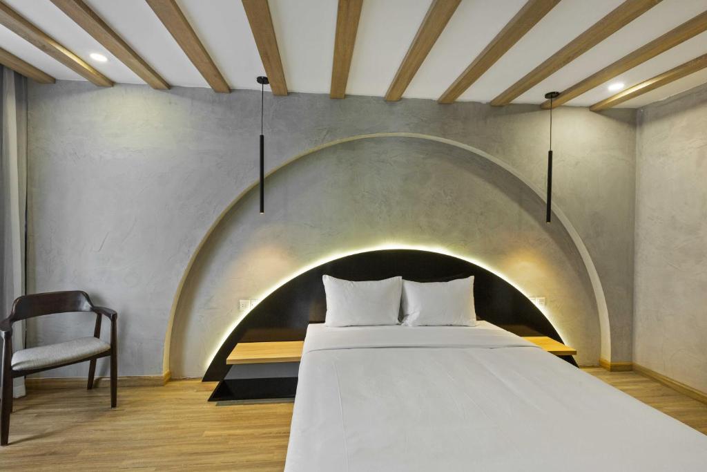 Postel nebo postele na pokoji v ubytování Jacayl Hotel TCG