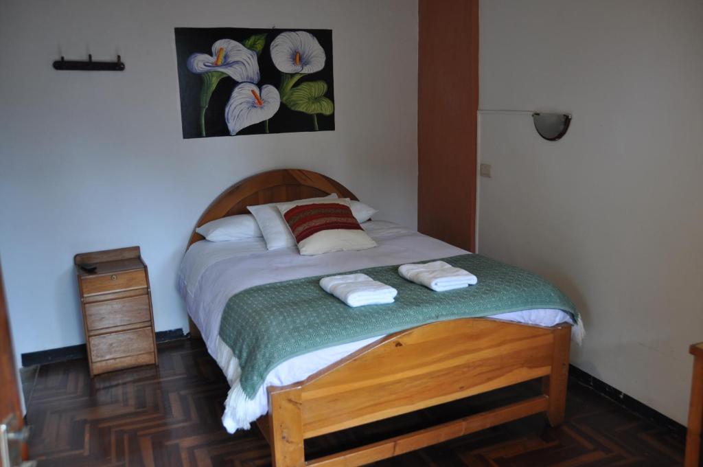 Postel nebo postele na pokoji v ubytování Las Orquideas Ollantaytambo