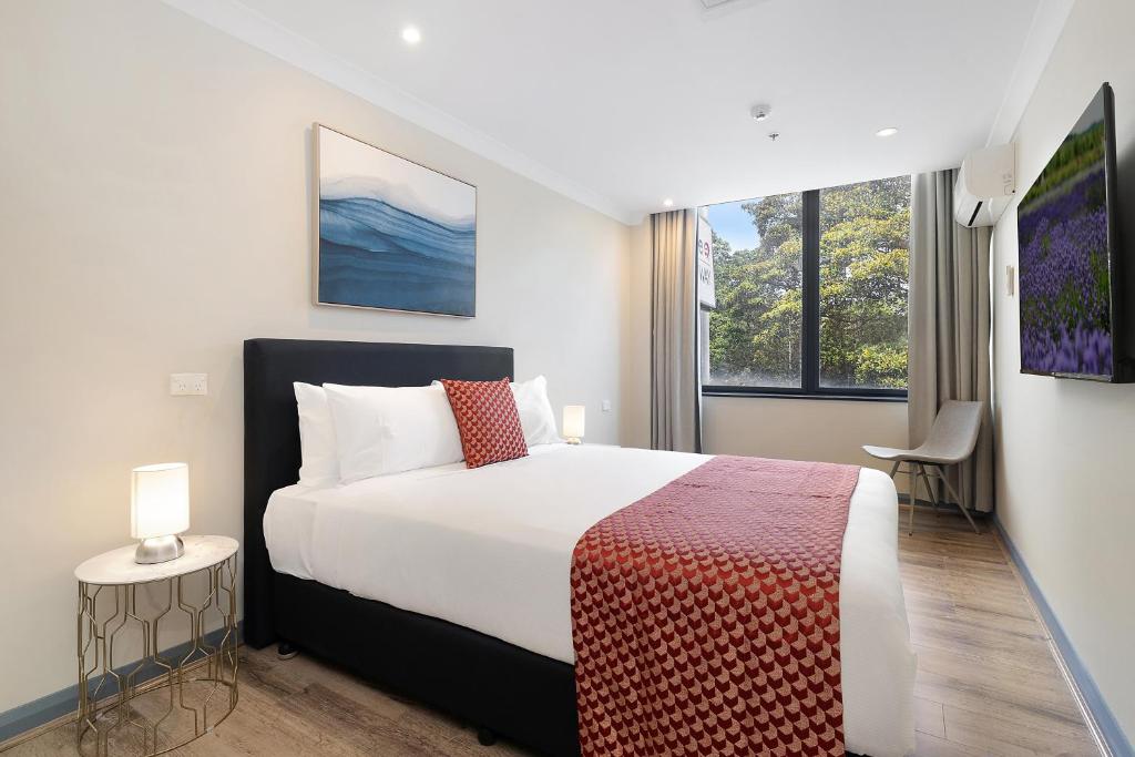 Postel nebo postele na pokoji v ubytování BreakFree on Broadway Sydney, an Accor Hotel