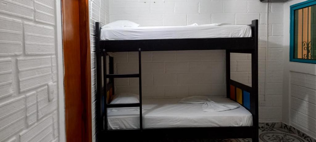 Postel nebo postele na pokoji v ubytování Apartamento Santorini Colombiano