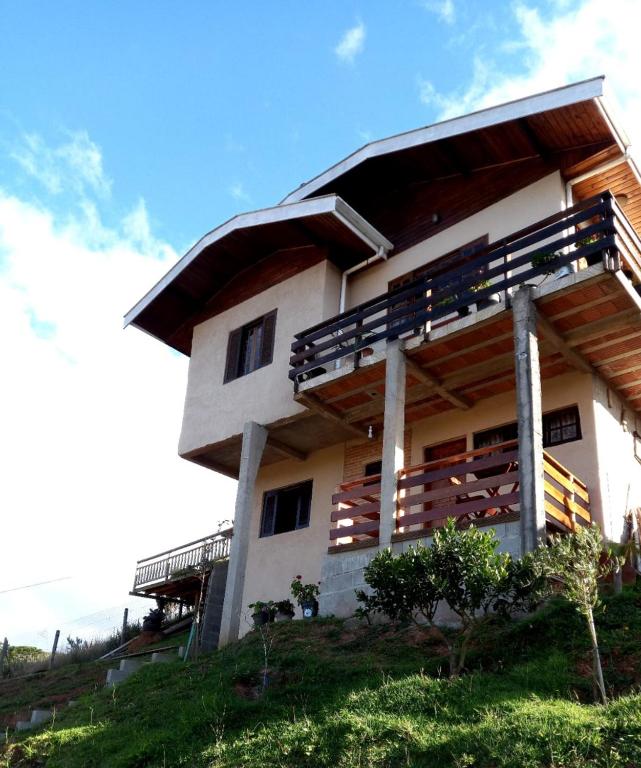 a building on top of a hill at Casa de Boneca in Campos do Jordão