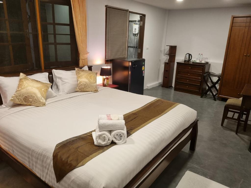 Postel nebo postele na pokoji v ubytování Meyers Hua Hin