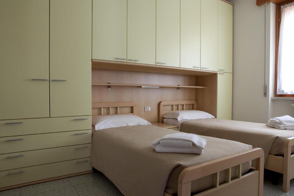 מיטה או מיטות בחדר ב-Residence Hotel Health House