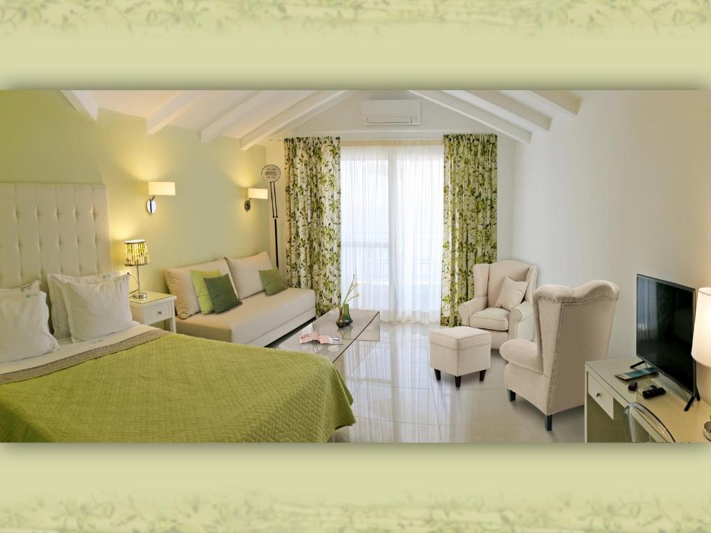 Телевизор и/или развлекательный центр в Haris Hotel Apartments and Suites