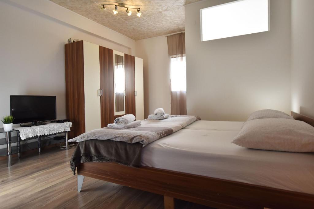 Posteľ alebo postele v izbe v ubytovaní Apartments ATM