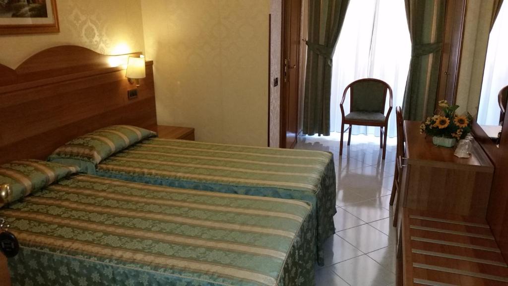 Postel nebo postele na pokoji v ubytování Hotel Teti
