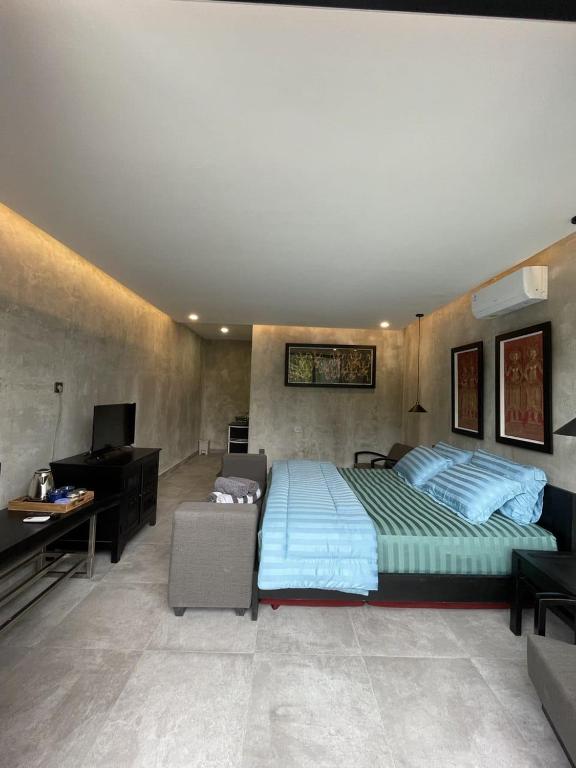 Postel nebo postele na pokoji v ubytování DJipangan Home