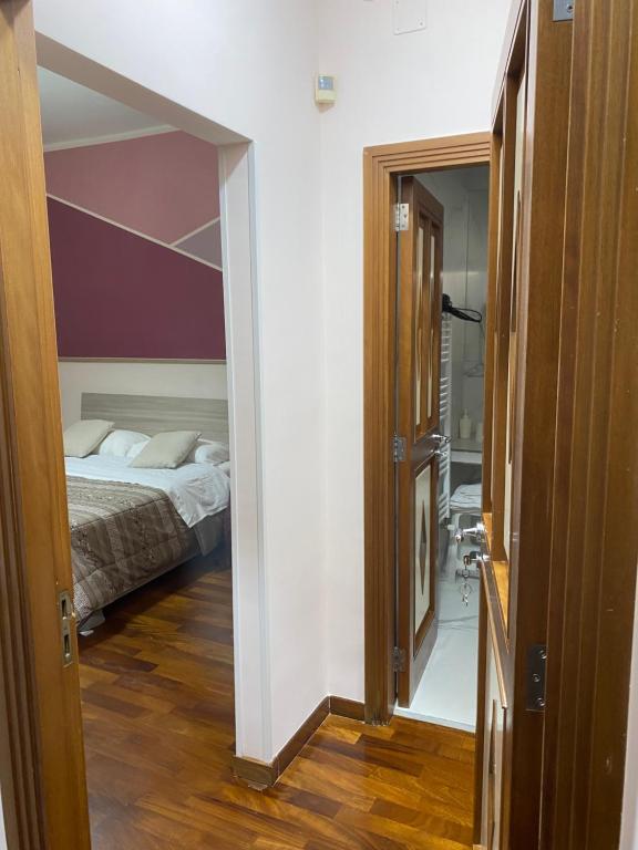 Postel nebo postele na pokoji v ubytování B&b Il miglio d’oro