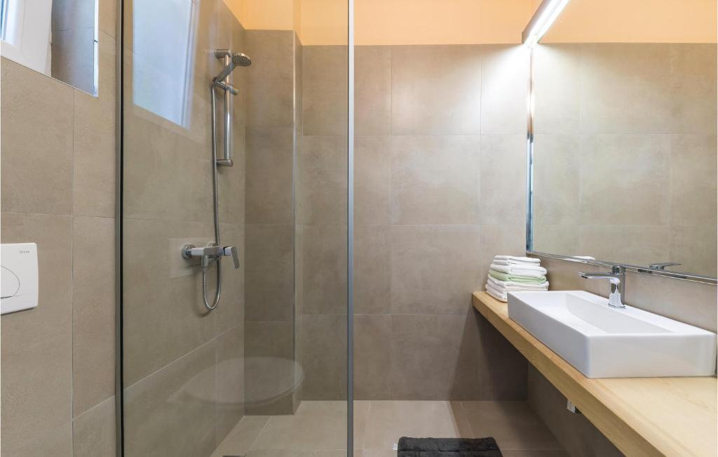 a bathroom with a shower and a sink at Amazing Home In Kastel Stari With Kitchen in Kastel Novi