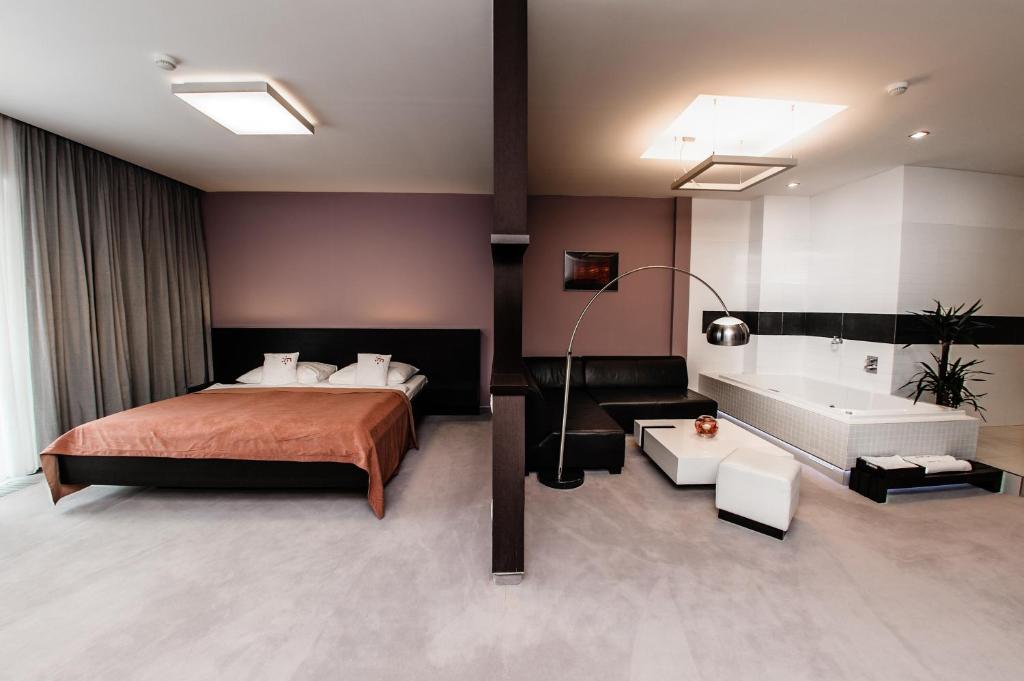 Postel nebo postele na pokoji v ubytování Hotel Magnus Trenčín