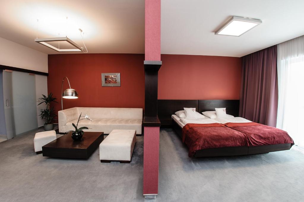 Postel nebo postele na pokoji v ubytování Hotel Magnus Trenčín