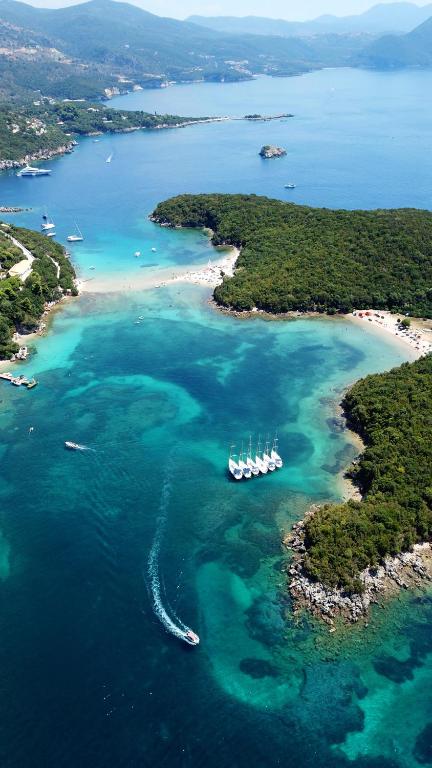 an aerial view of a beach with boats in the water at Baia Blu Apartments in Syvota