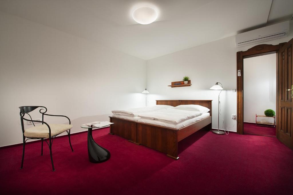 Postel nebo postele na pokoji v ubytování Brioni Suites