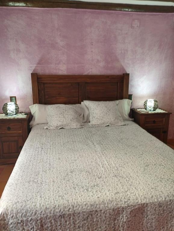 Postel nebo postele na pokoji v ubytování CASA RURAL LES ROQUETES