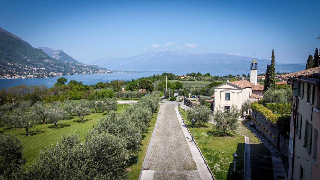 arial view of a town with a lake and a building at B&B Il Piccolo Paradiso in San Felice del Benaco