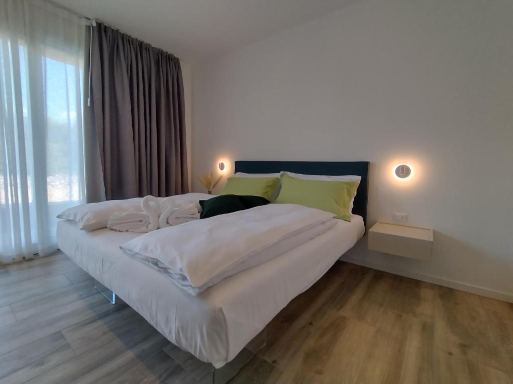 Ένα ή περισσότερα κρεβάτια σε δωμάτιο στο LA CORTESE by La Rondinella Apartments