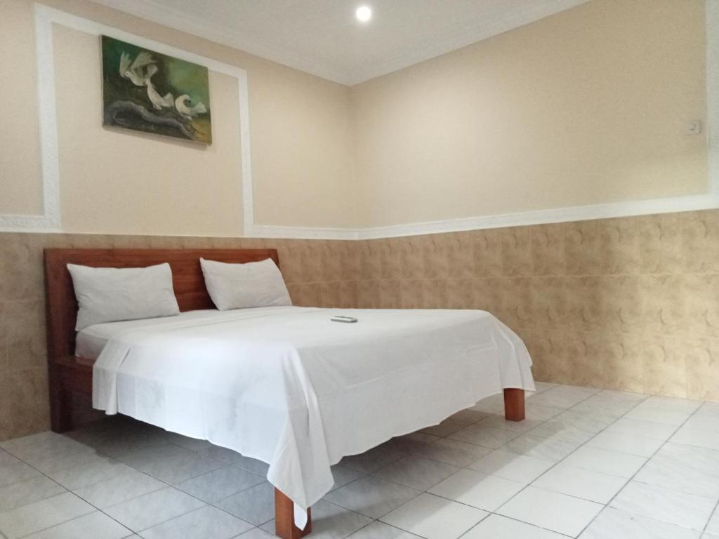 Postel nebo postele na pokoji v ubytování Homestay Lucu 2
