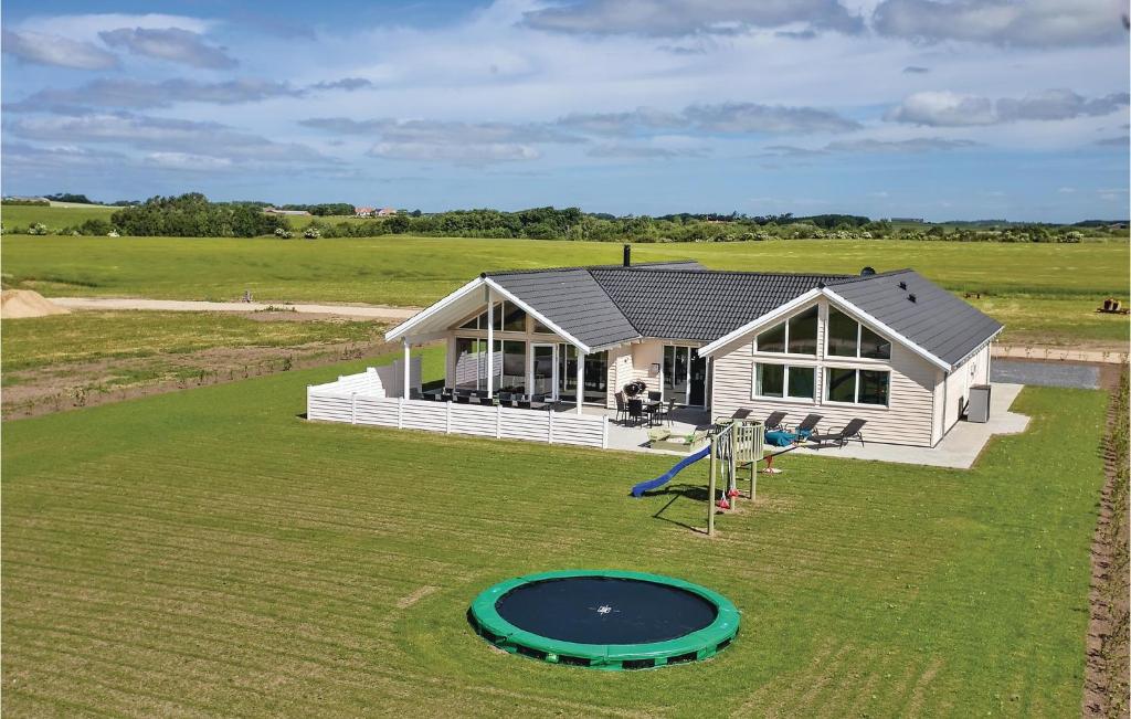an aerial view of a house with a playground at Lovely Home In Spttrup With Sauna in Lem