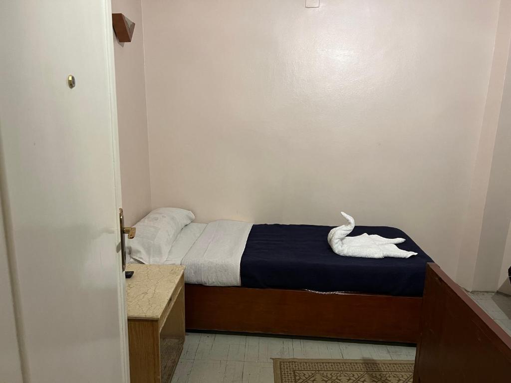 Postel nebo postele na pokoji v ubytování Anglo Hotel
