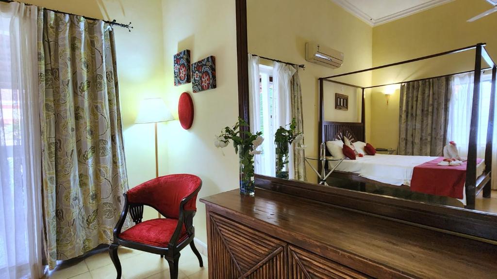 Postel nebo postele na pokoji v ubytování Villa Cavelossim