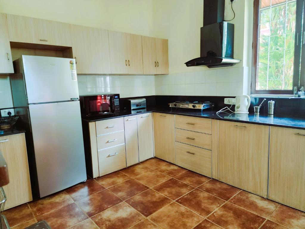 Kuchyň nebo kuchyňský kout v ubytování Villa Cavelossim